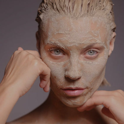 Photo of beautiful woman using Alitura Clay Mask