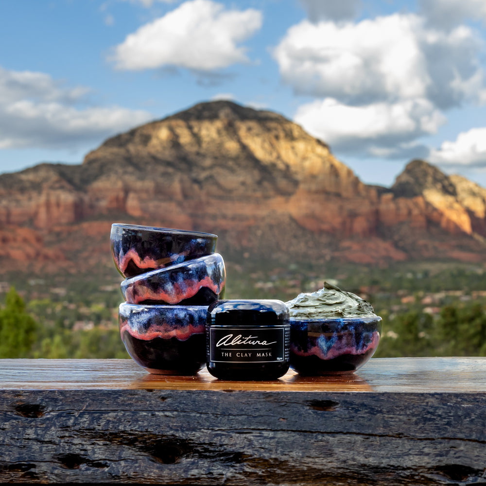 Stack of ceramic bowls with a mountainous landscape in the background