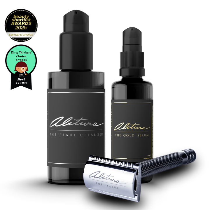 Two black bottles labeled 'The Pearl Cleanser' and 'The Gold Serum' with a silver razor on a white background, featuring awards badges.