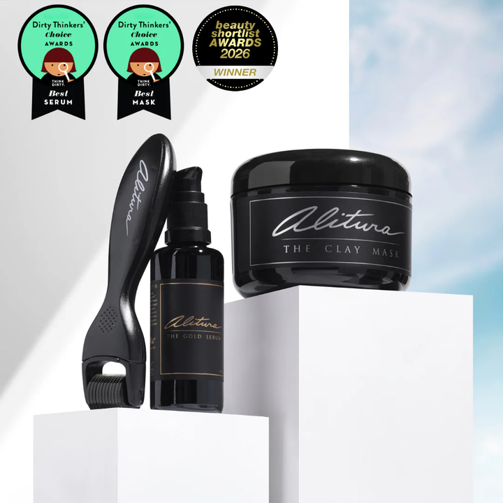 Alitura skincare products including a jar, bottle, and brush on a white background with awards displayed.