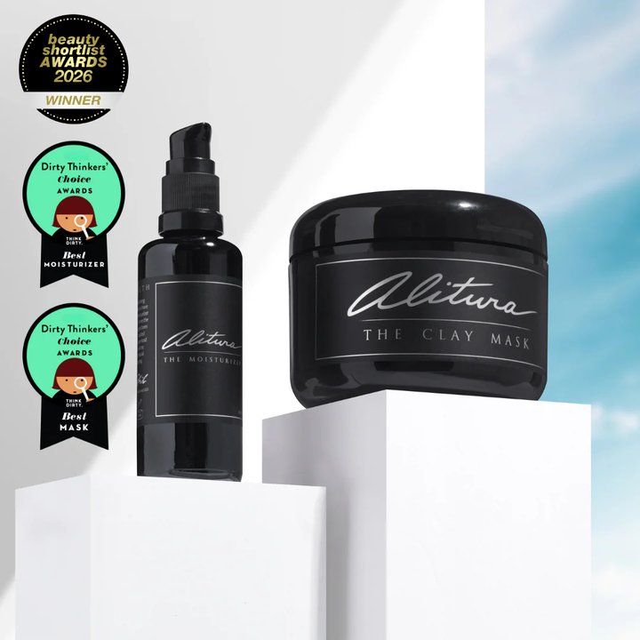 Alitura skincare products including a bottle and a jar on a white background with awards displayed.