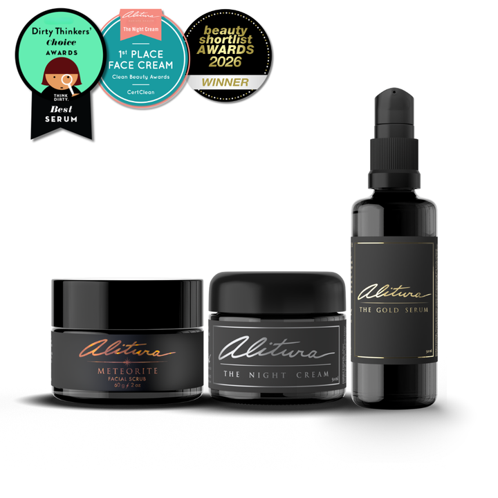 Alitura skincare products including a serum, night cream, and facial scrub with awards on a white background.