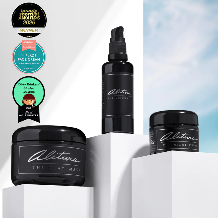 Alitura skincare products including a bottle and jars on a white background with awards displayed.