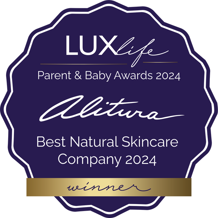 A decorative award badge for the 2024 LUXlife Parent & Baby Awards, recognizing Alitura as the Best Natural Skincare Company. The badge is dark purple with white text and a gold ribbon at the bottom on a white background.